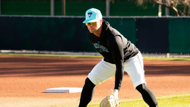 Christian Walker fielding baseballs at Spring Training Practice